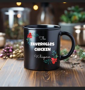 A black mug standing on a wooden bench with herbs. on the mug are the words faverolles chicken whisperer.