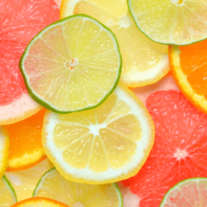 "Sliced citrus fruits including lime, lemon, orange, and grapefruit, not suitable for chickens' diet."